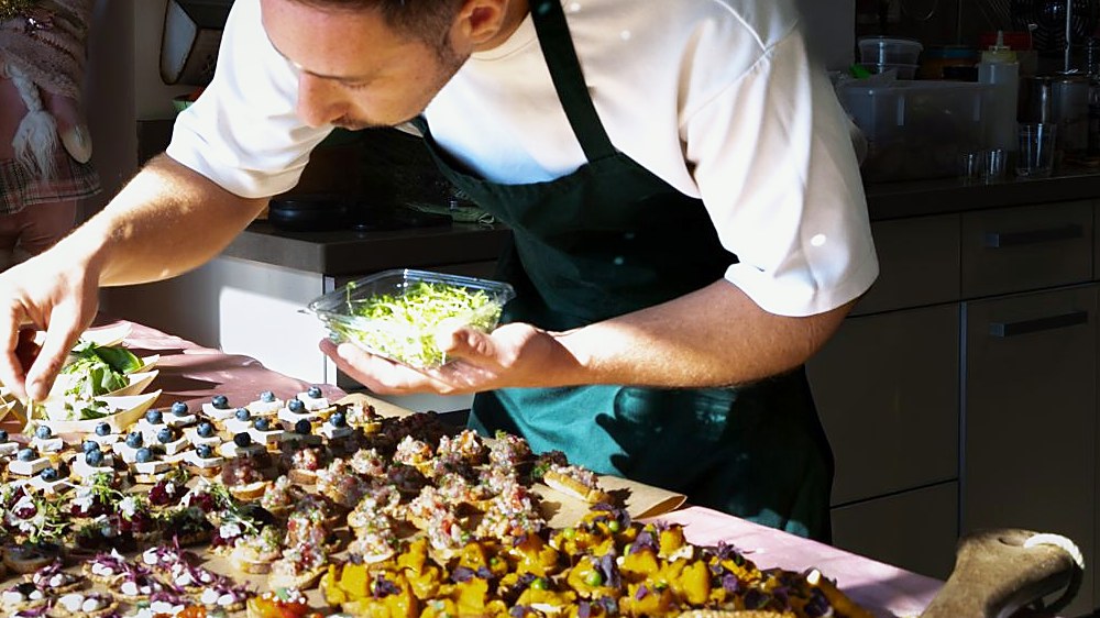 Daniel finishing canapés by hand
